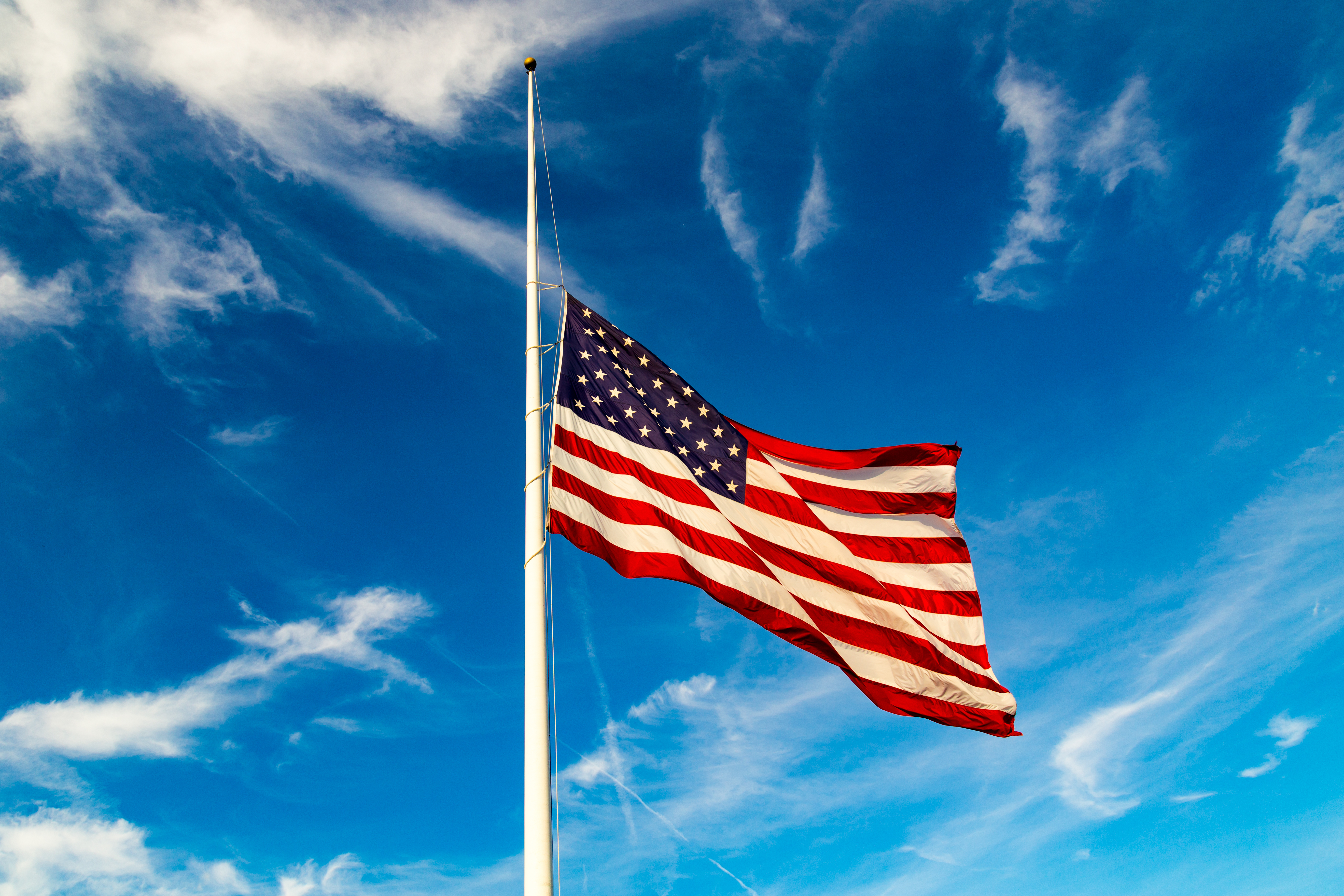 american flag at half staff