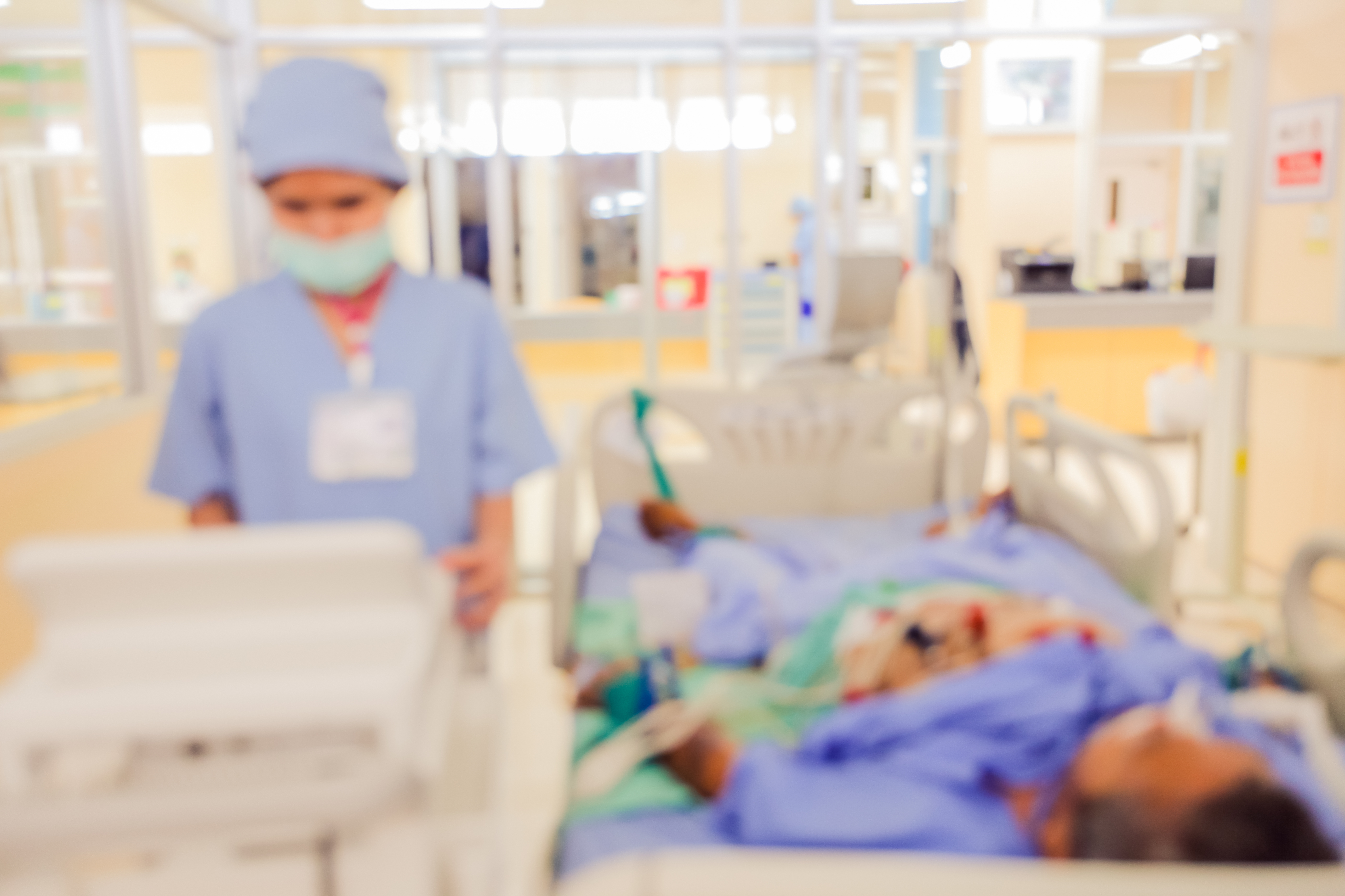 Blurred image of a patient in critical condition in the ICU ward.