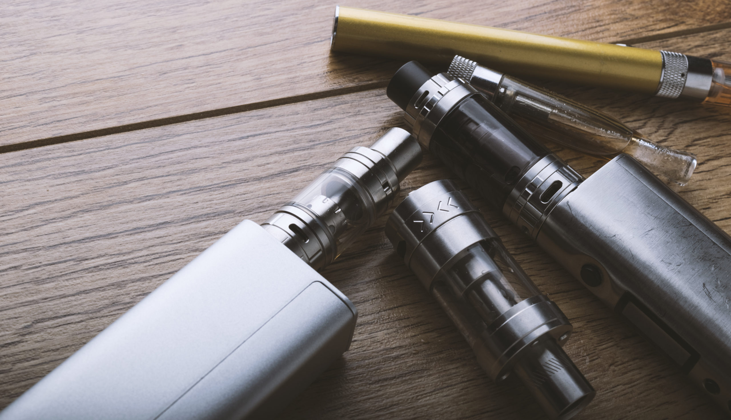 Several vaping devices on a table