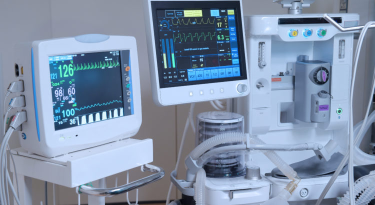 hospital equipment, including heart rate monitor and oxygen monitor functioning at bedside.