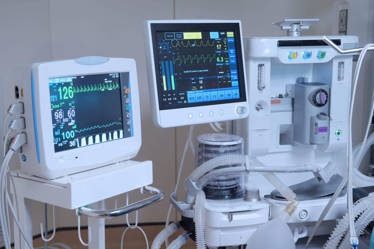 hospital equipment, including heart rate monitor and oxygen monitor functioning at bedside.