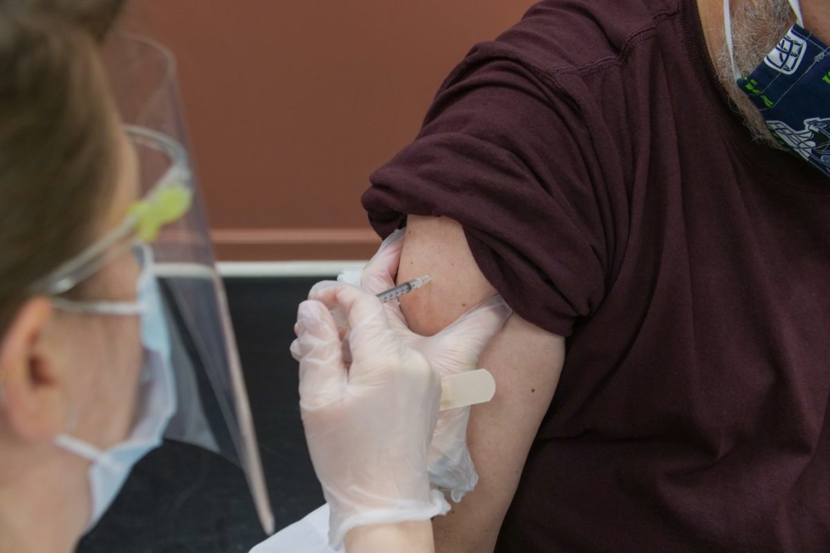 Patient receives Covid-19 vaccine.