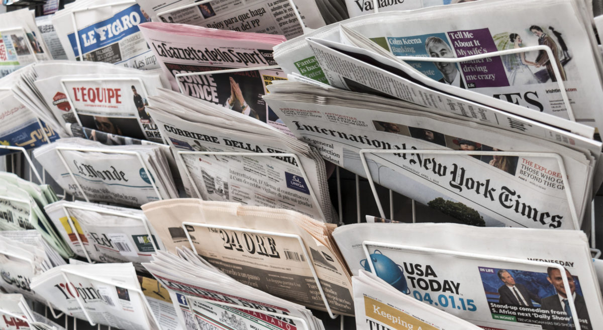 LONDON, UNITED KINGDOM- 1 APRIL 2015: A newspaper rack holding several international newspapers, such as The International New York Times, USA Today, Irish Times, Londra Sera and Corriere Della Sera.