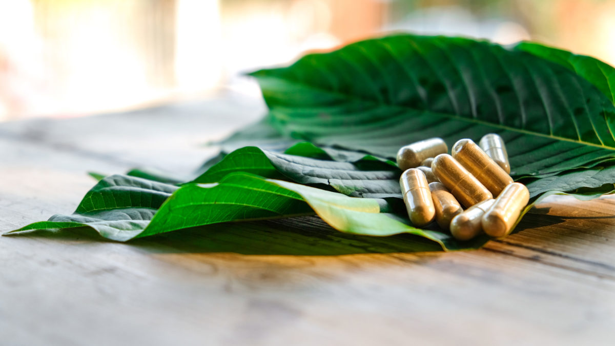 Kratom leaves and capsules.