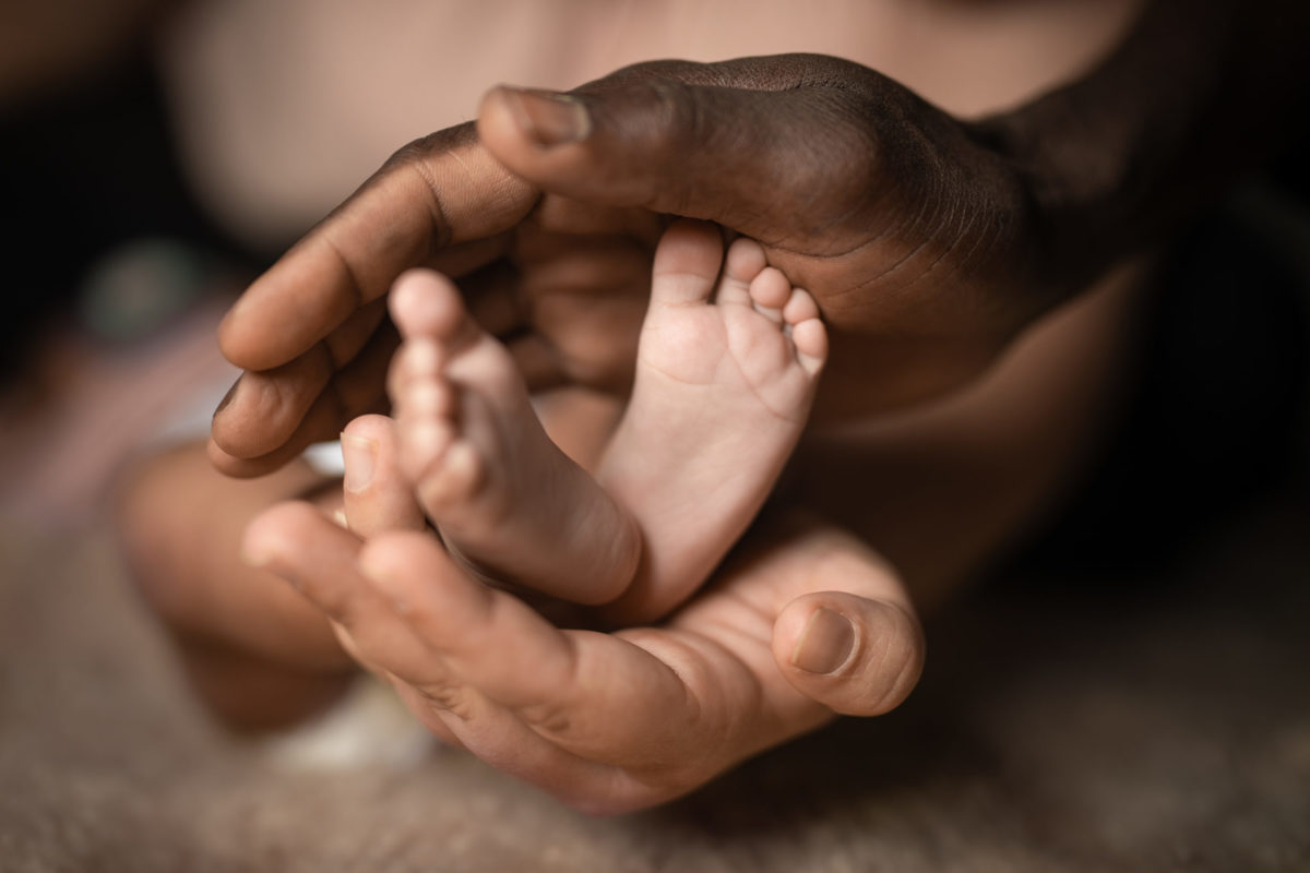 Baby feet in hands