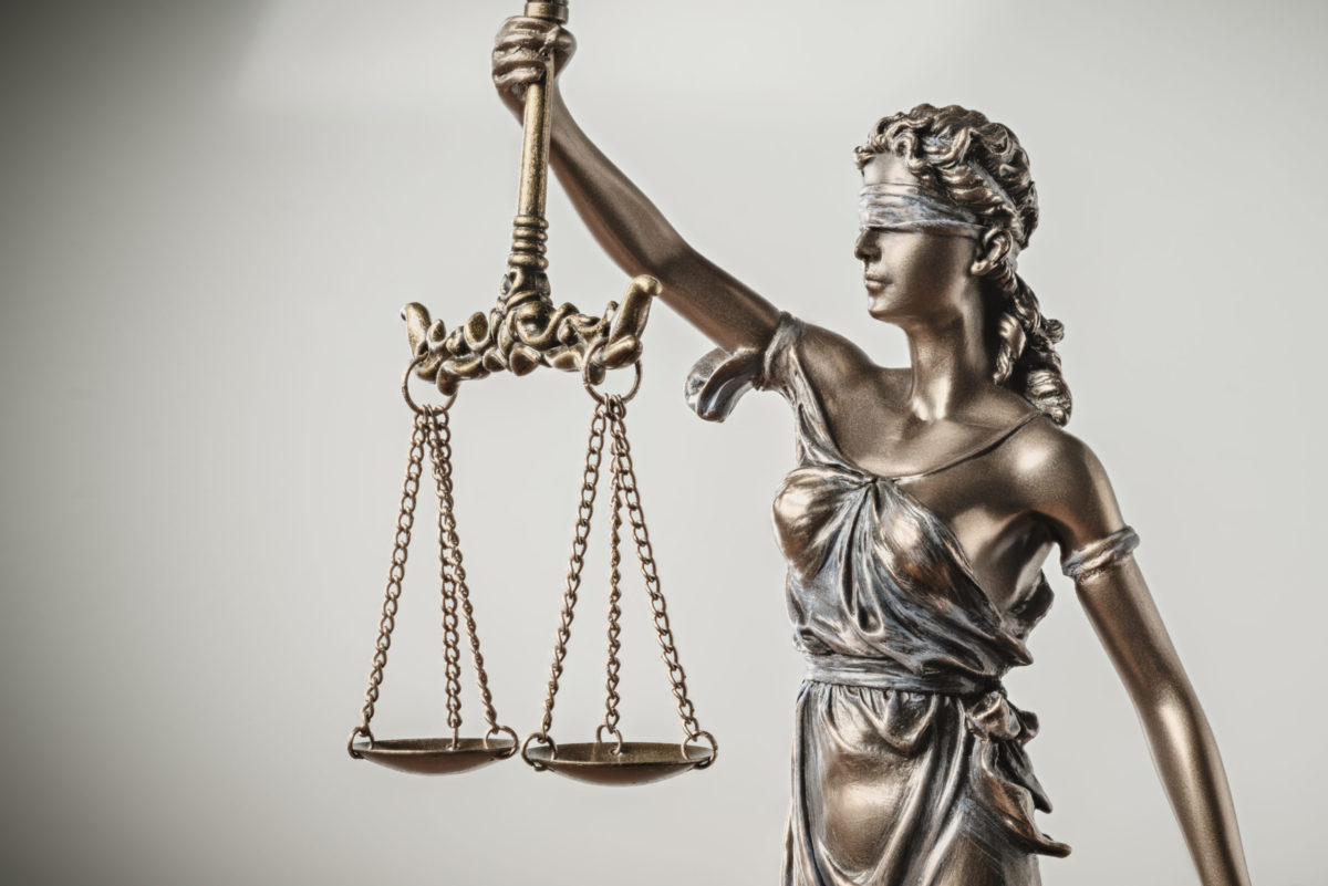 Lady Justice blindfolded with scales.