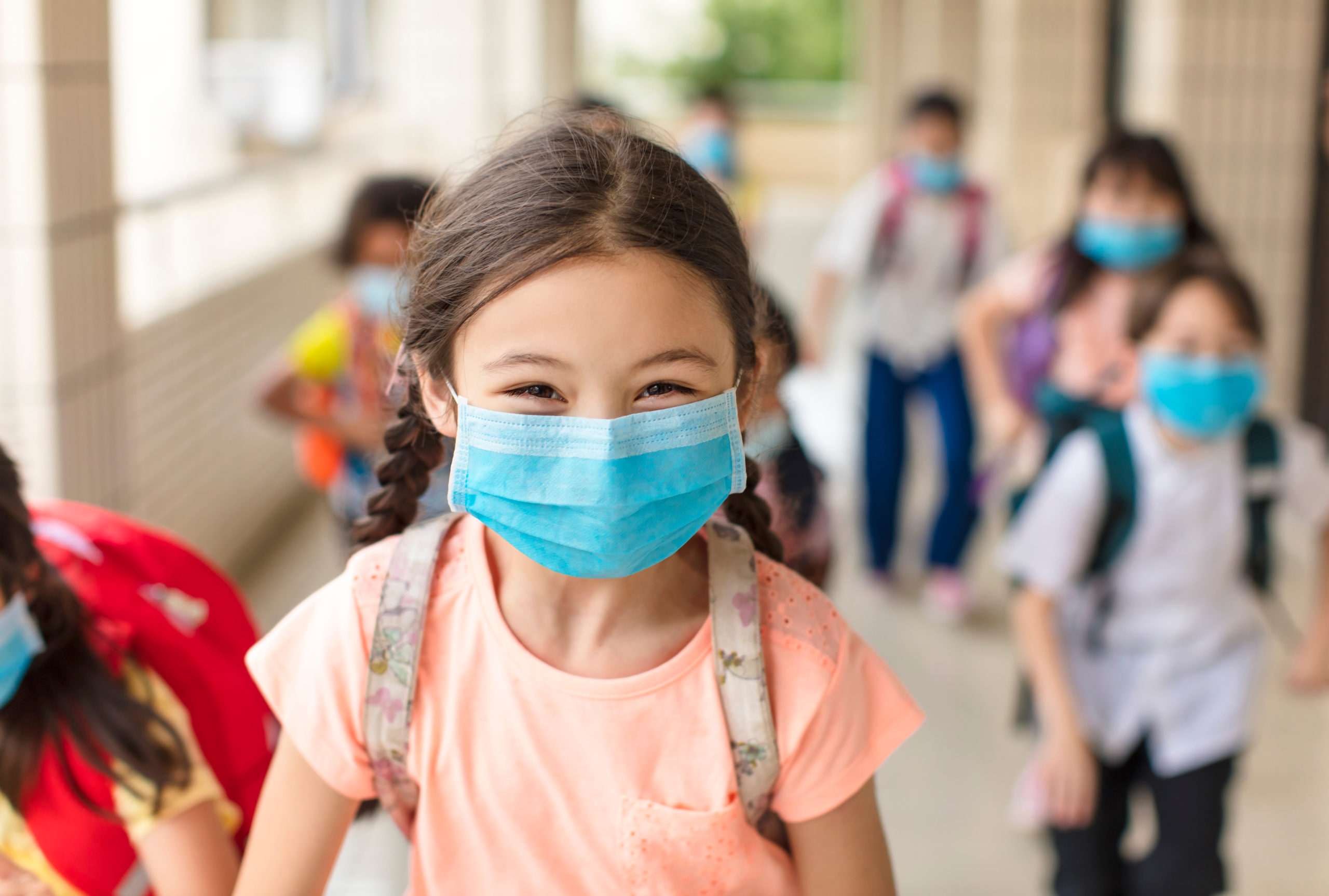 children wearing masks.