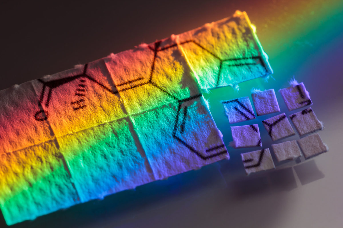 pieces of paper with chemical structures, micro dosing concept.