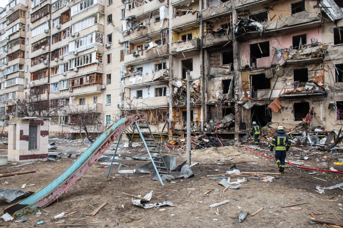 KYIV, UKRAINE - Feb. 25, 2022: War of Russia against Ukraine. A residential building damaged by an enemy aircraft in the Ukrainian capital Kyiv.