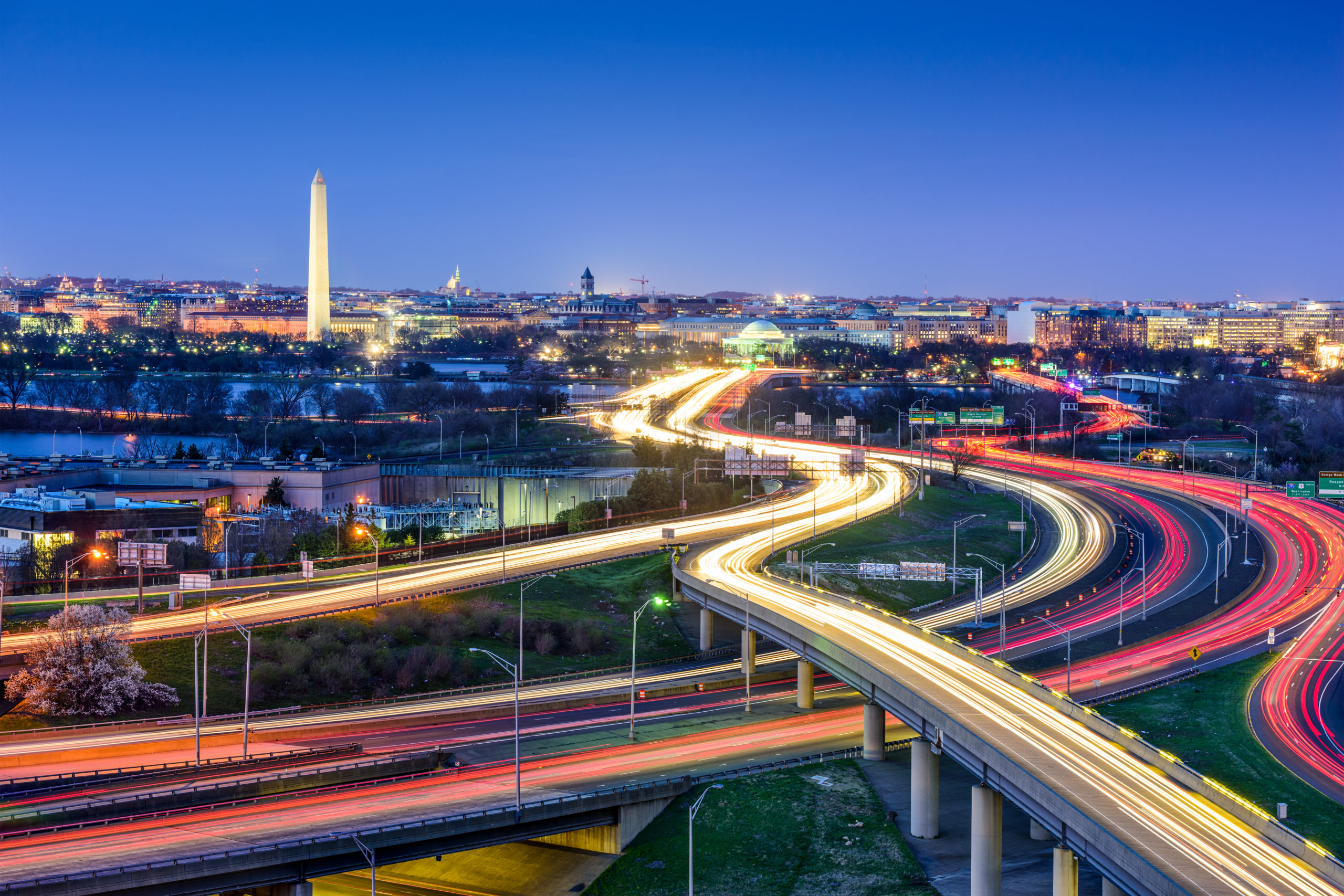 Washington, D.C. skyline with highways and monuments.