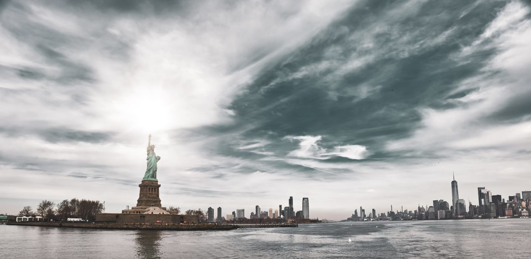 New York city, NY, USA, Statue of Liberty with sun in background, 11,3,2022.