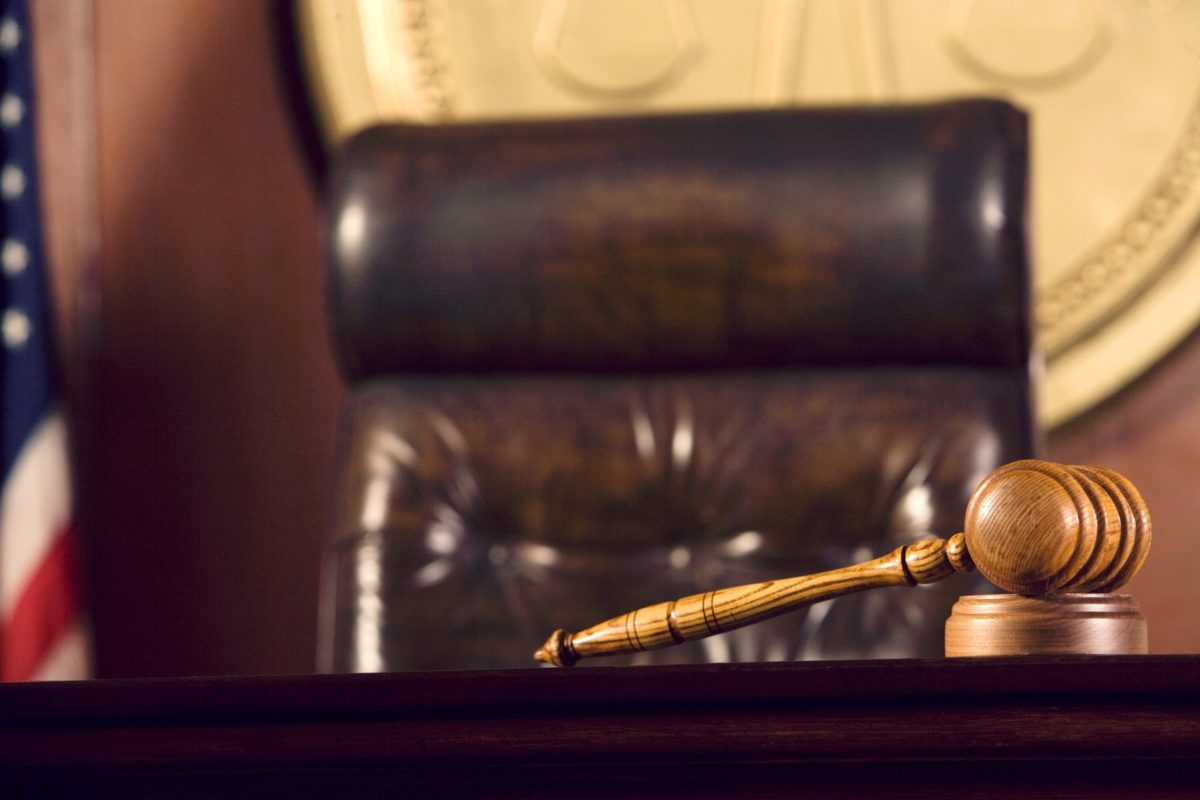 Gavel lying in a courtroom.