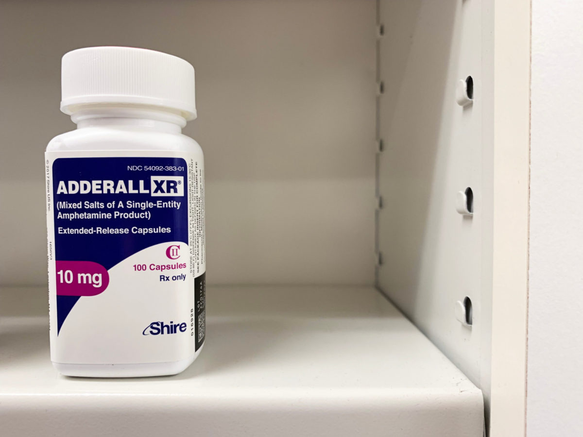 Adderall bottle on shelf.