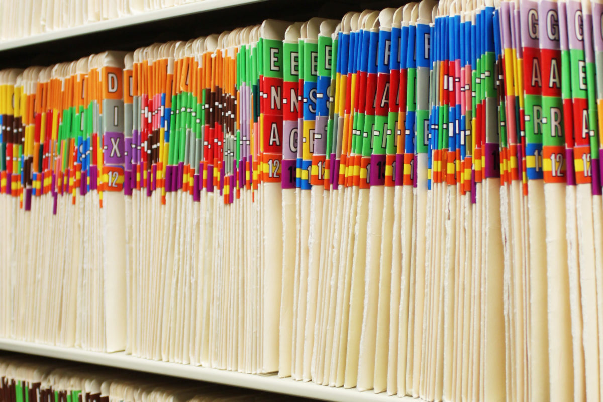 File folders containing medical records.