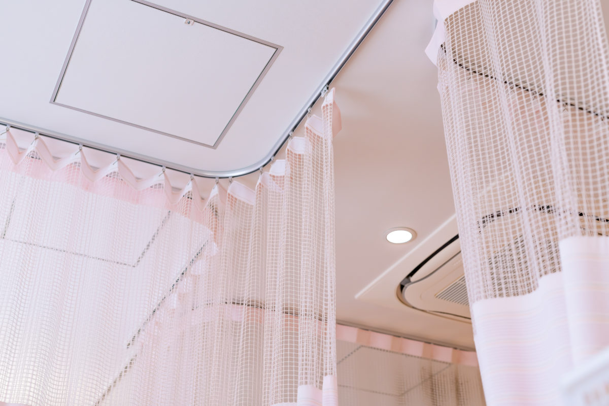 privacy curtain around hospital bed.