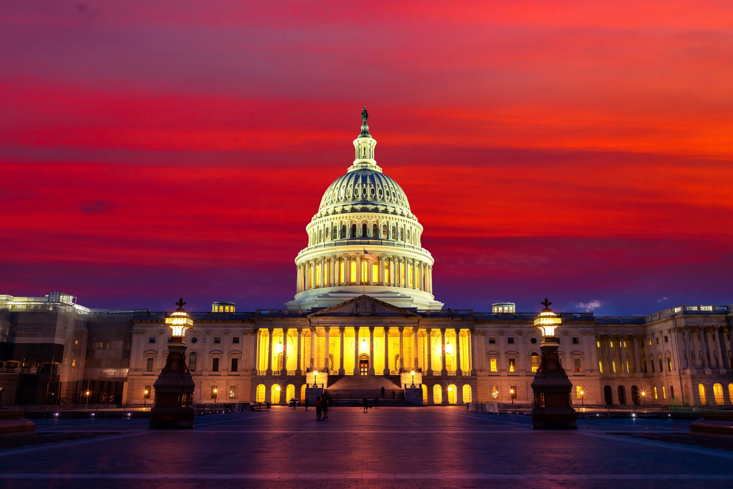 The United States Capitol building at sunset at night in Washington DC, USA