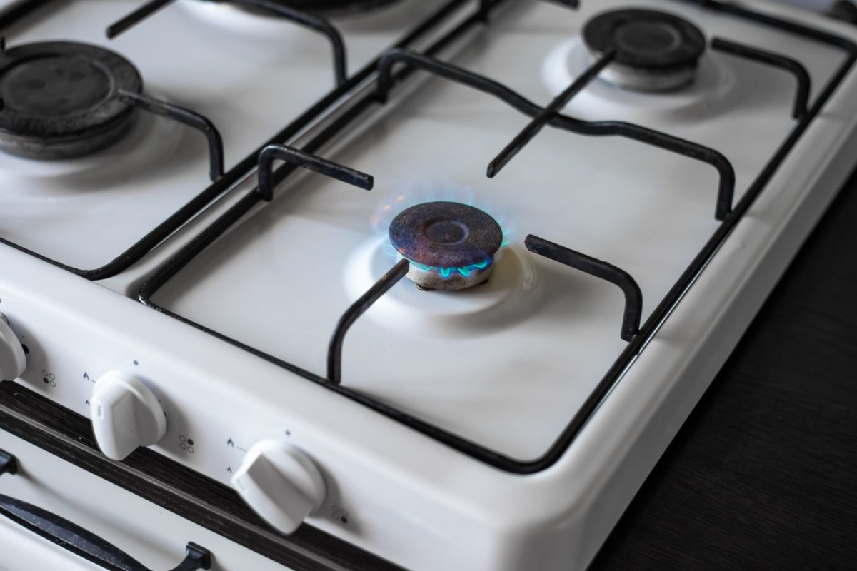 Gas stove burner with burning gas. Sale and purchase of gas fuel.