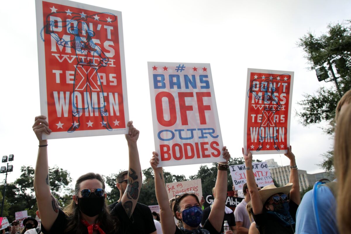 Austin, TX, USA - Oct. 2, 2021: Participants at the Women's March rally at the Capitol protest SB 8, Texas' abortion law that effectively bans abortions after six weeks of pregnancy.