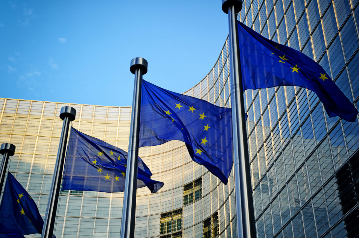 EU flags in front of European Commission in Brussels.