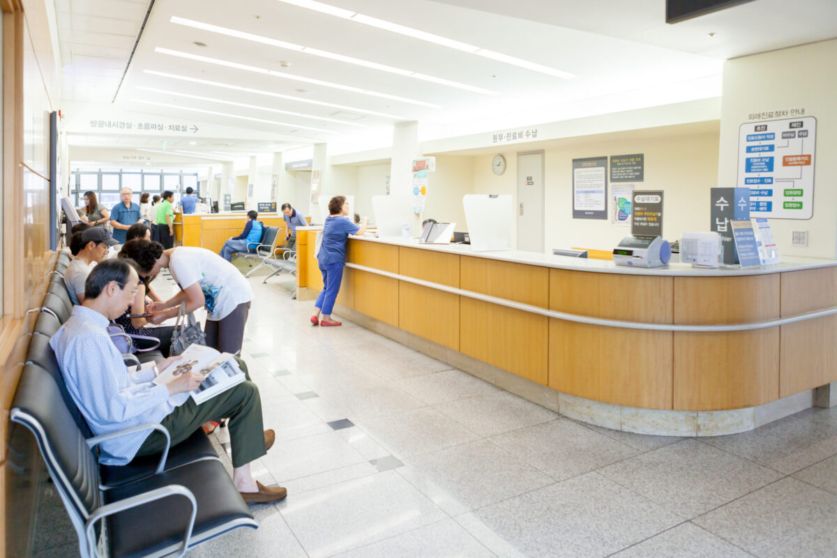 SEOUL, KOREA - AUGUST 12, 2015: A number of people waiting at registration desk of Severance hospital of Yonsei University,