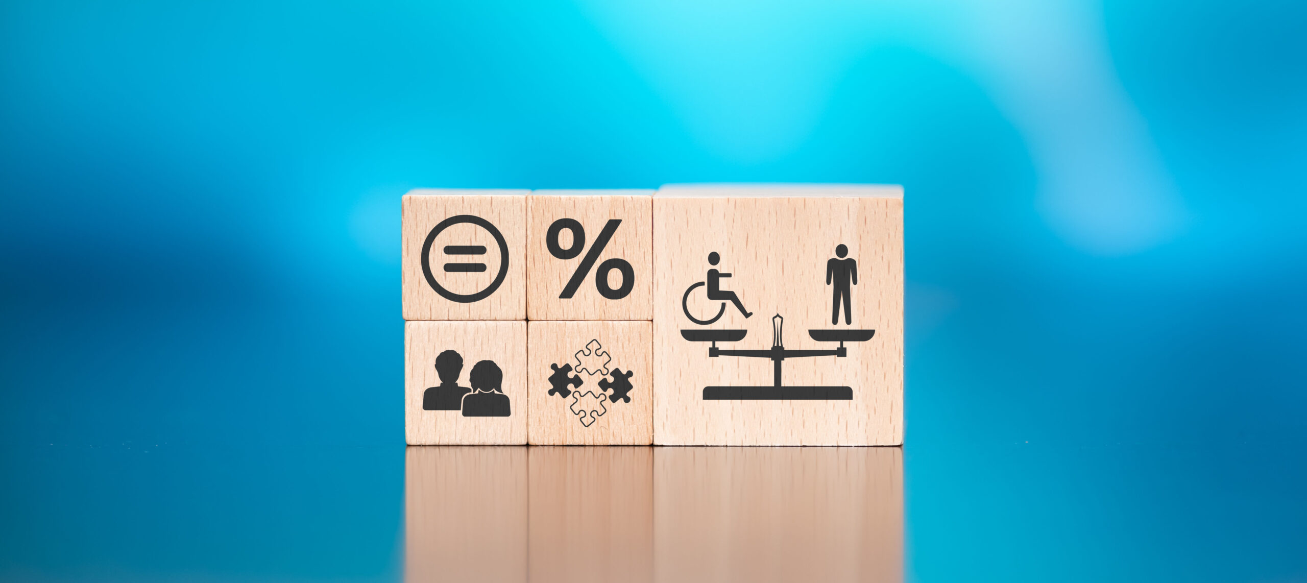 Wooden blocks with symbol of social equality concept on blue background.