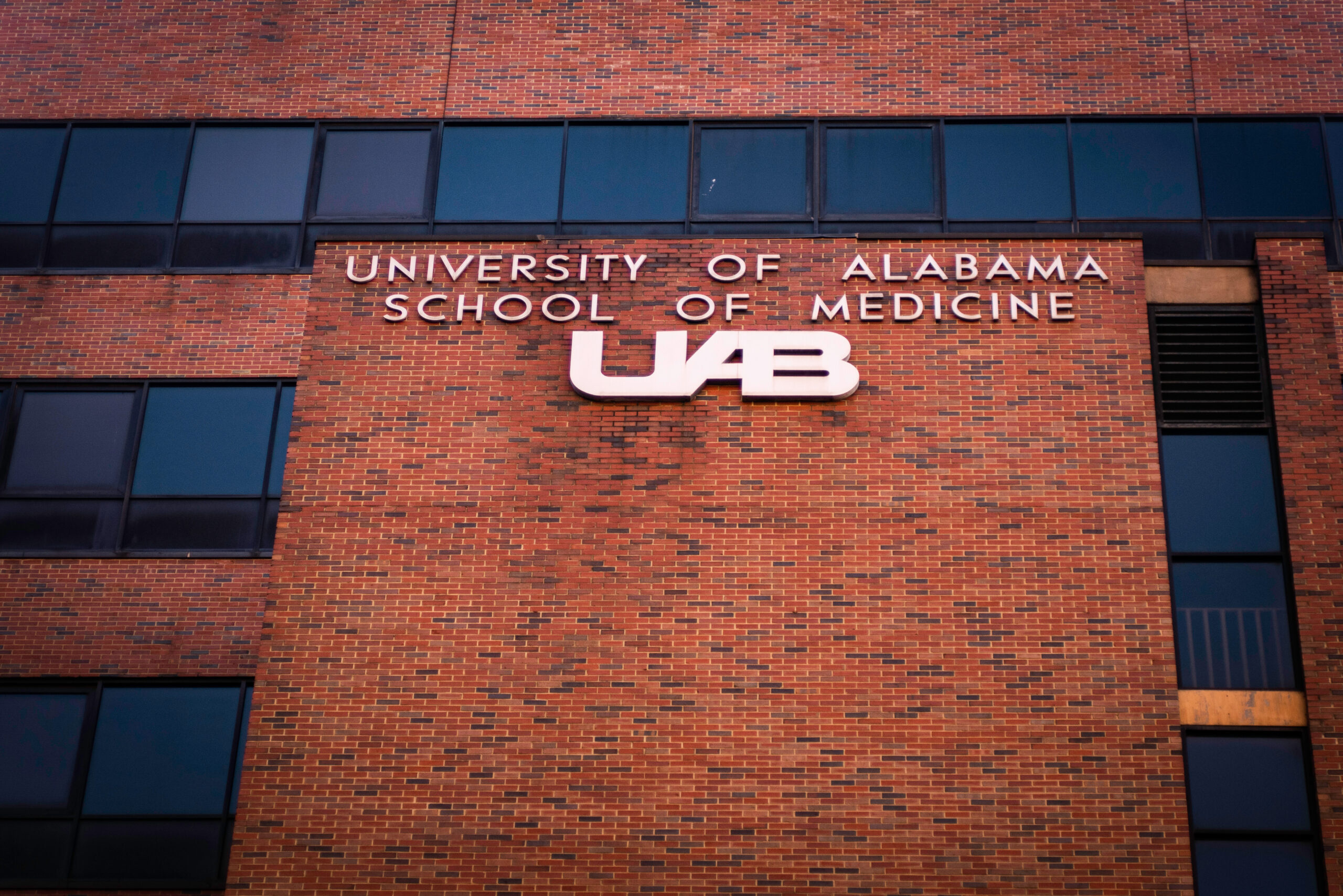 Birmingham, Alabama - February 8, 2020: University of Alabama at Birmingham UAB Hospital title and logo on brick facade.